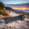 AR15 12 INCH  M-LOK Free Float Handguard with Integrated Hand stop sitting on a cliff with sunset in the background