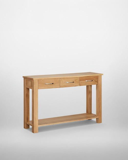 Mobel Oak Console Table COR02C, wooden console table with three drawers and a lower shelf, crafted from oak with modern metal handles, ideal for hallway or living room decor. Mobel Oak Console Table COR02C, wooden console table with three drawers and a lower shelf, crafted from oak with modern metal handles, ideal for hallway or living room decor.