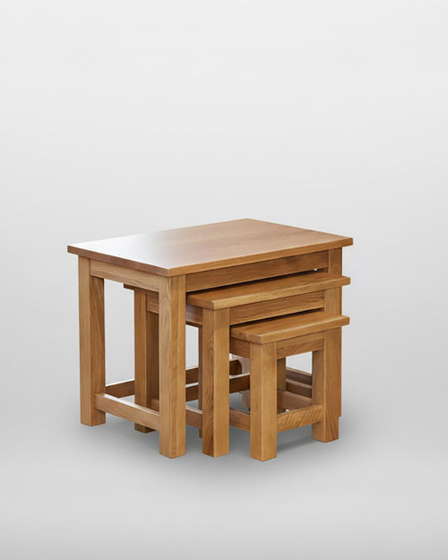 Mobel Oak Nest of Three Coffee Tables COR08A, set of three wooden nesting tables with a natural oak finish placed together on a white background. Mobel Oak Nest of Three Coffee Tables COR08A, set of three wooden nesting tables with a natural oak finish placed together on a white background.