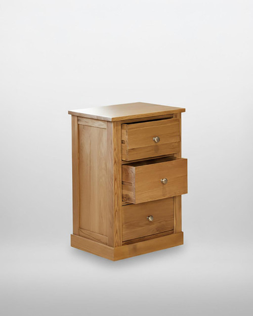 Mobel Oak Three Drawer Lamp Table COR10B, wooden lamp table with three drawers and silver knobs, crafted from natural oak wood in a classic design.