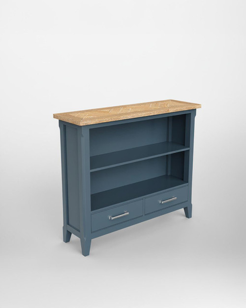 Signature Blue Low Bookcase CFR01A, blue wooden bookcase with two open shelves and two drawers at the bottom, featuring a natural wood top surface. Signature Blue Low Bookcase CFR01A, blue wooden bookcase with two open shelves and two drawers at the bottom, featuring a natural wood top surface.