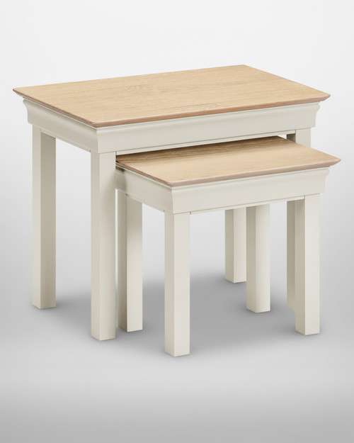 Vermont Nest of 2 Tables in Ivory/Oak, product image showing two wooden nesting tables with ivory finished legs and oak finished tabletops.