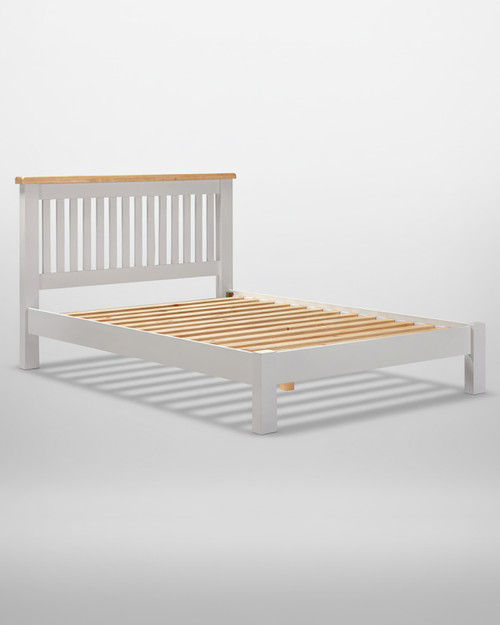 Hampton Pebble Grey 4'6" Bed Low Foot End HG200-203-132, a modern bed frame with a white finish, wooden slats, and a natural wood top on the headboard.
