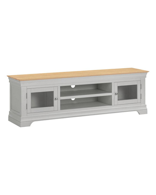 Vermont TV Stand in Pebble Grey/Oak VM300-305-061, a contemporary TV stand with pebble grey body, natural oak top, glass-paneled doors, and open shelves for media devices and storage. Vermont TV Stand in Pebble Grey/Oak VM300-305-061, a contemporary TV stand with pebble grey body, natural oak top, glass-paneled doors, and open shelves for media devices and storage.