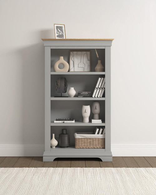 Vermont Bookcase in Pebble Grey/Oak VM300-306-055, a stylish and functional storage piece with multiple shelves filled with decorative items and books.