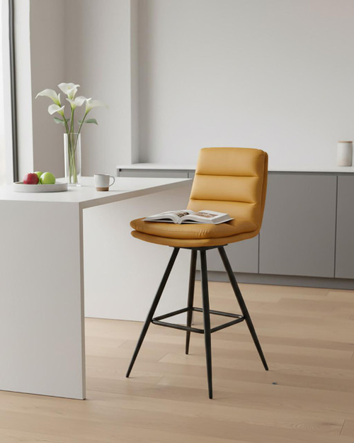Hamilton Swivel Bar Chair In Ochre, a modern yellow swivel bar chair with a cushioned seat and backrest, black metal legs, and a sleek design in a minimalistic kitchen setting.