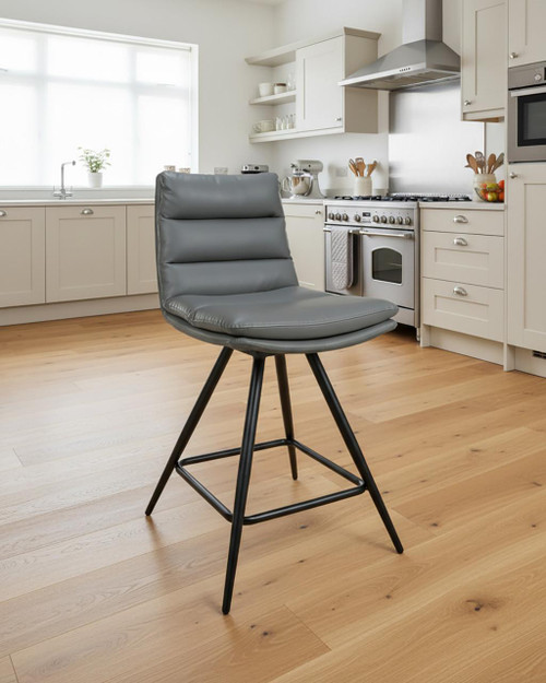 Hamilton Swivel Counter Chair in Grey, modern upholstered counter chair with black metal base in a kitchen setting. Hamilton Swivel Counter Chair in Grey, modern upholstered counter chair with black metal base in a kitchen setting.