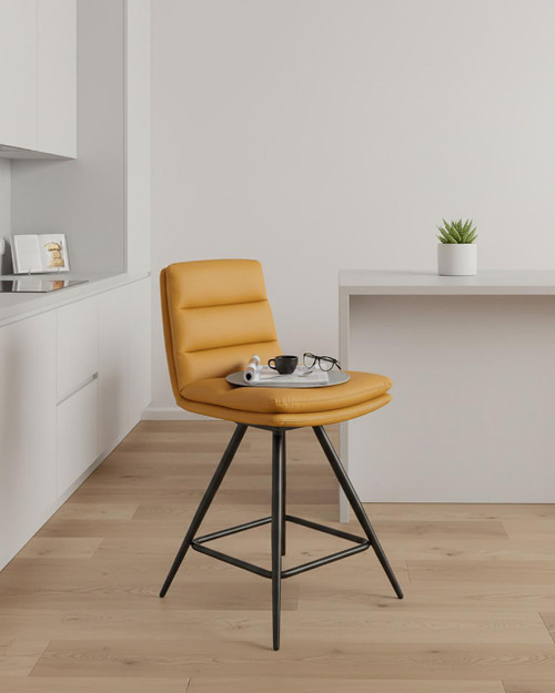 Hamilton Swivel Counter Chair in Ochre, modern yellow leather swivel chair with black metal legs, placed in a minimalist room setting with white walls and light wooden flooring. Hamilton Swivel Counter Chair in Ochre, modern yellow leather swivel chair with black metal legs, placed in a minimalist room setting with white walls and light wooden flooring.