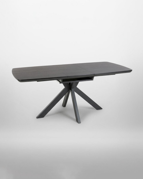 Hamilton Black Ash Extending Table 140cm - 180cm table, modern black ash wood dining table with extendable feature, featuring a unique angular leg design set against a plain white background.