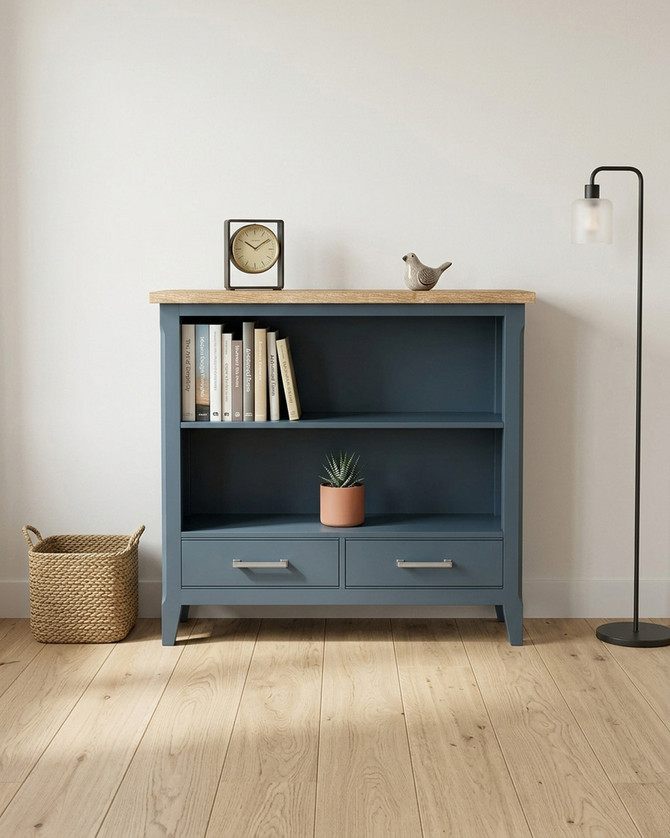 Anchorage Blue Low Bookcase WFS-BH-ANC01A, blue wooden bookcase with two open shelves and two drawers at the bottom, featuring a natural wood top surface.