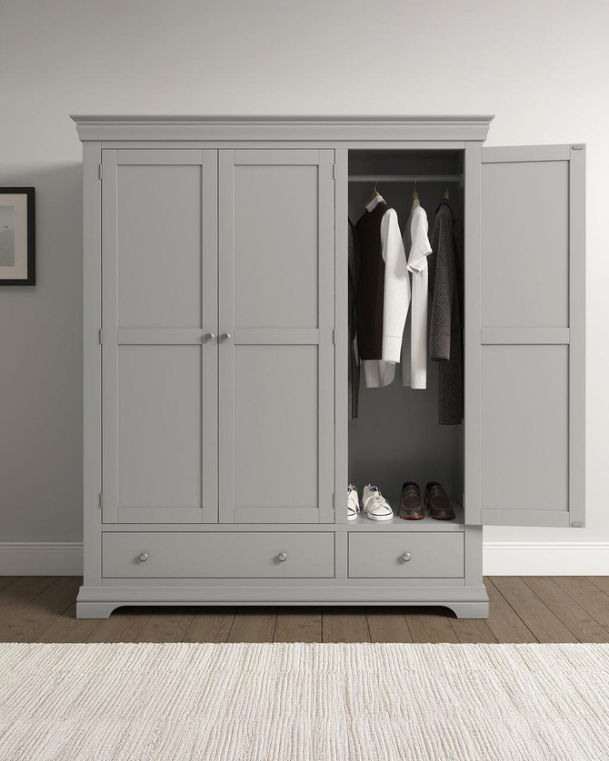Vermont 3 Door Wardrobe in Pebble Grey VM100-101-234, a modern wardrobe with three doors, including a partially open door revealing hanging clothes and shoes inside.