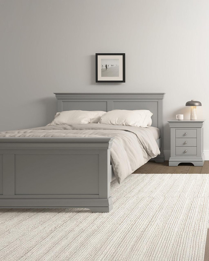Vermont 5' Bed High Foot End in Pebble Grey VM200-204-060, in a modern bedroom with a light grey wooden bed frame, matching bedside table, and minimalistic decor.