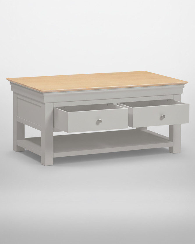 Vermont 2 Drawer Coffee Table in Pebble Grey/Oak VM300-301-091, showing a close-up of the white drawer with a round silver handle and part of the wooden tabletop.
