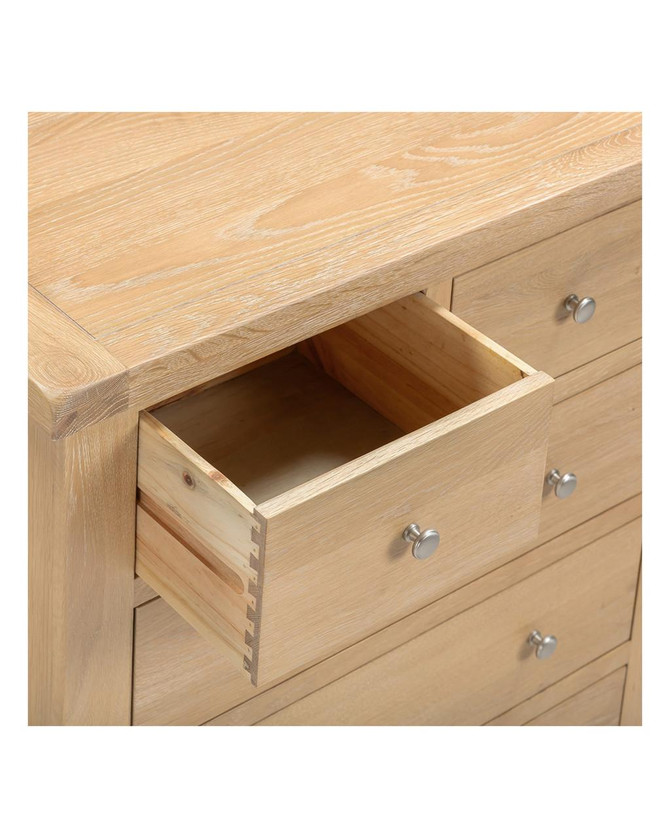 Hampton Oak 3+2 Drawer Chest HO100-102-221, close-up of open drawer showing natural oak wood grain and wooden dovetail joints.