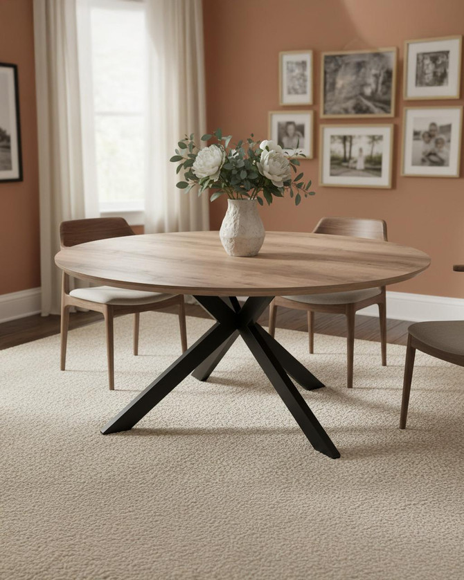 Roma 180cm Light Walnut Oval Table, modern wooden dining table with light walnut finish and black crossed legs in a cozy dining room with framed black and white pictures and floral centerpiece.