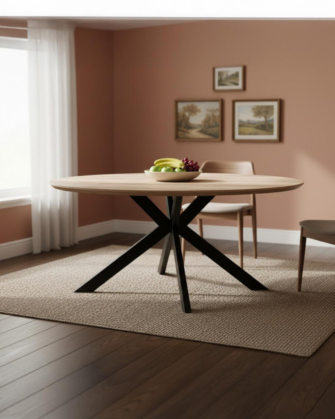 Roma 180cm Distressed Oak Oval Table, modern oval wooden dining table with a black X-shaped base in a cozy dining room setting.