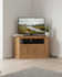 Stockbury Solid Oak Corner Television Cabinet WFS-BH-SBO09C, wooden TV stand with open shelf and double-door cabinets in oak finish.