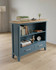 Anchorage Blue Low Bookcase WFS-BH-ANC01A, blue wooden bookcase with two open shelves and two drawers at the bottom, featuring a natural wood top surface.