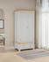 Hampton Pebble Grey 2 Door 1 Drawer Wardrobe HG100-101-230, white wardrobe with natural wood accents, in a bright room with curtains and a rugs.