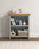 Hampton Pebble Grey Low Bookcase HG300-306-053, a grey wooden bookshelf with open shelves, decorated with books, vases, and picture frames, in a modern interior setting.