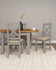 Hampton Pebble Grey Extending Dining Table HG400-403-076, gray extendable dining table with wooden top and matching gray chairs in a modern dining room setting.