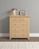 Hampton Oak 3+2 Drawer Chest HO100-102-221, wooden bedroom storage unit with five drawers and round metal knobs, placed against a light grey wall with decorative items on top.