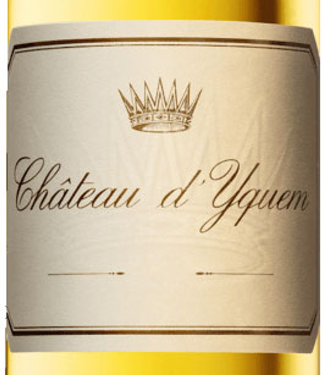 Elegant bottle of Château d'Yquem Sauternes 2019 375ml with a filled wine glass.