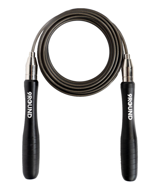 A flat lay image of a jump rope with a black cord and black metal handles with a white 9Round logo