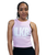 A woman looking confidently at the camera wearing a pink cropped tank top with an I Love Kickboxing logo (ILKB)