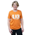 A woman with short blonde hair wearing an orange t-shirt that reads ILKB I love Kickboxing