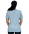 A woman in a grey t-shirt facing away from the camera showing the back of the shirt, which is plain