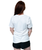 A woman facing away from the camera wearing a white t-shirt with nothing pictured on the back