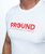 A close up of the logo on a white t-shirt that reads 9Round Kickboxing Fitness in red text