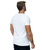 A man facing away from the camera wearing a white t-shirt with nothing pictured on the back