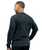 A back view of a male wearing a long-sleeve black and grey acid wash t-shirt