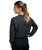 A back view of a woman wearing a long-sleeve black and grey acid wash t-shirt