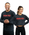 A young adult male and female in a long-sleeve black and grey acid wash t-shirt with a red 9Round logo on the front center