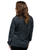 A back view of a woman wearing a long-sleeve black and grey acid wash t-shirt