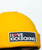 A close up of the navy patch on a yellow beanie that reads I Love Kickboxing.