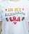 A close up view of a white t-shirt that reads, "In my kickboxing era," in a fun yellow, red, and grey bubble text design with an I Love Kickboxing heart logo underneath.