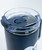 A close up of the clear lid of a navy tumbler with a flippable cover to sip or stick a straw