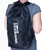 A person wearing a black backpack with a white I Love Kickboxing logo running vertically down the large front pocket