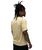 A person with long, twisted hair stands in profile, wearing a short-sleeved gold shirt and black shorts against a white background.