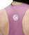 A person wearing a pink racerback tank top with a white 9R logo printed on the upper back.