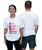 A woman facing forward and a man facing backward wear white T-shirts; the woman’s shirt reads EAT SLEEP KICK REPEAT I LOVE KICKBOXING.