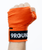 A person making a fist in the air with their hand wearing n orange boxing hand wrap that reads 9Round across the wrist 
