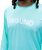 Person wearing a mint green long-sleeve shirt with the word 9ROUND printed in white on the chest. Only the lower face, neck, and upper torso are visible.
