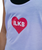 Person wearing a light purple tank top with a red heart graphic containing the letters ILKB on the chest.