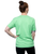 The back of a woman wearing a green t-shirt with her hair up in a bun
