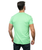 The back of a man wearing a green t-shirt